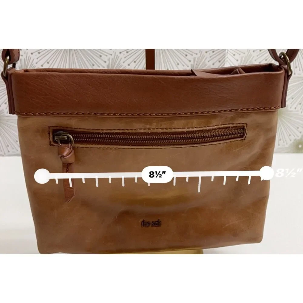 The Sak matte floral embossed tan leather Sanibel crossbody bag
